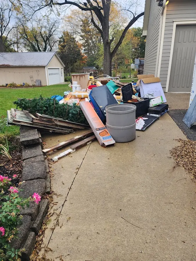 Dumpster being loaded with debris for 30 Yard Dumpster Rental in Montvale